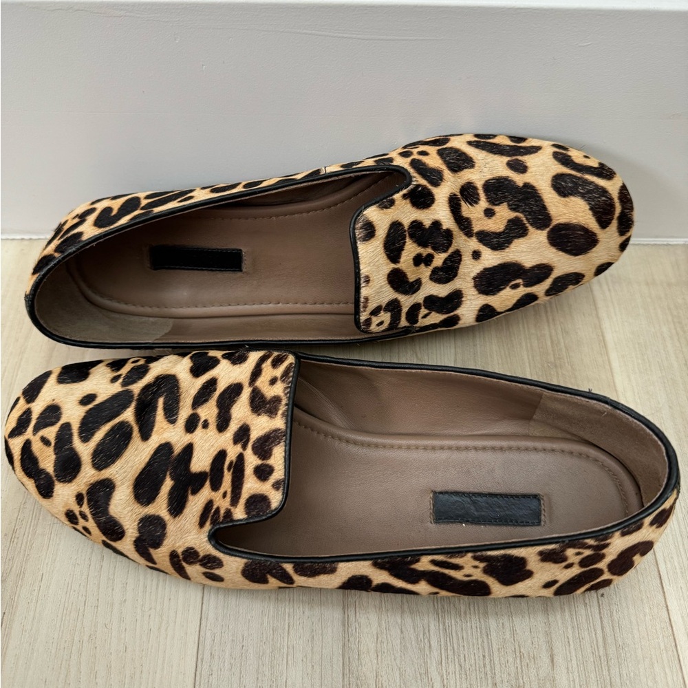 Ecco leopard print slip on loafers.
